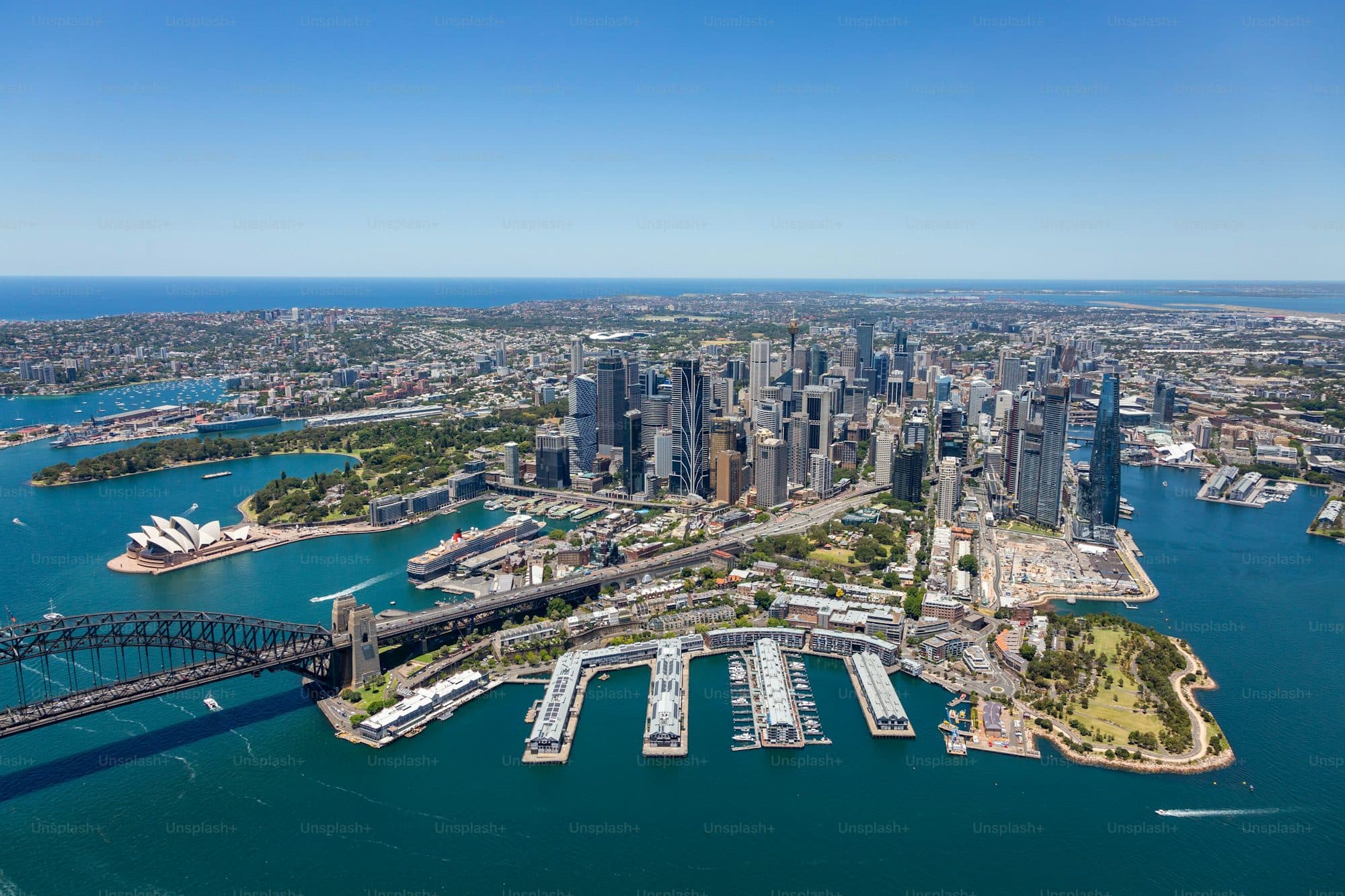 Aerial view of Sydney harbour and apartment buildings — the cityscape at the centre of NSW strata disputes