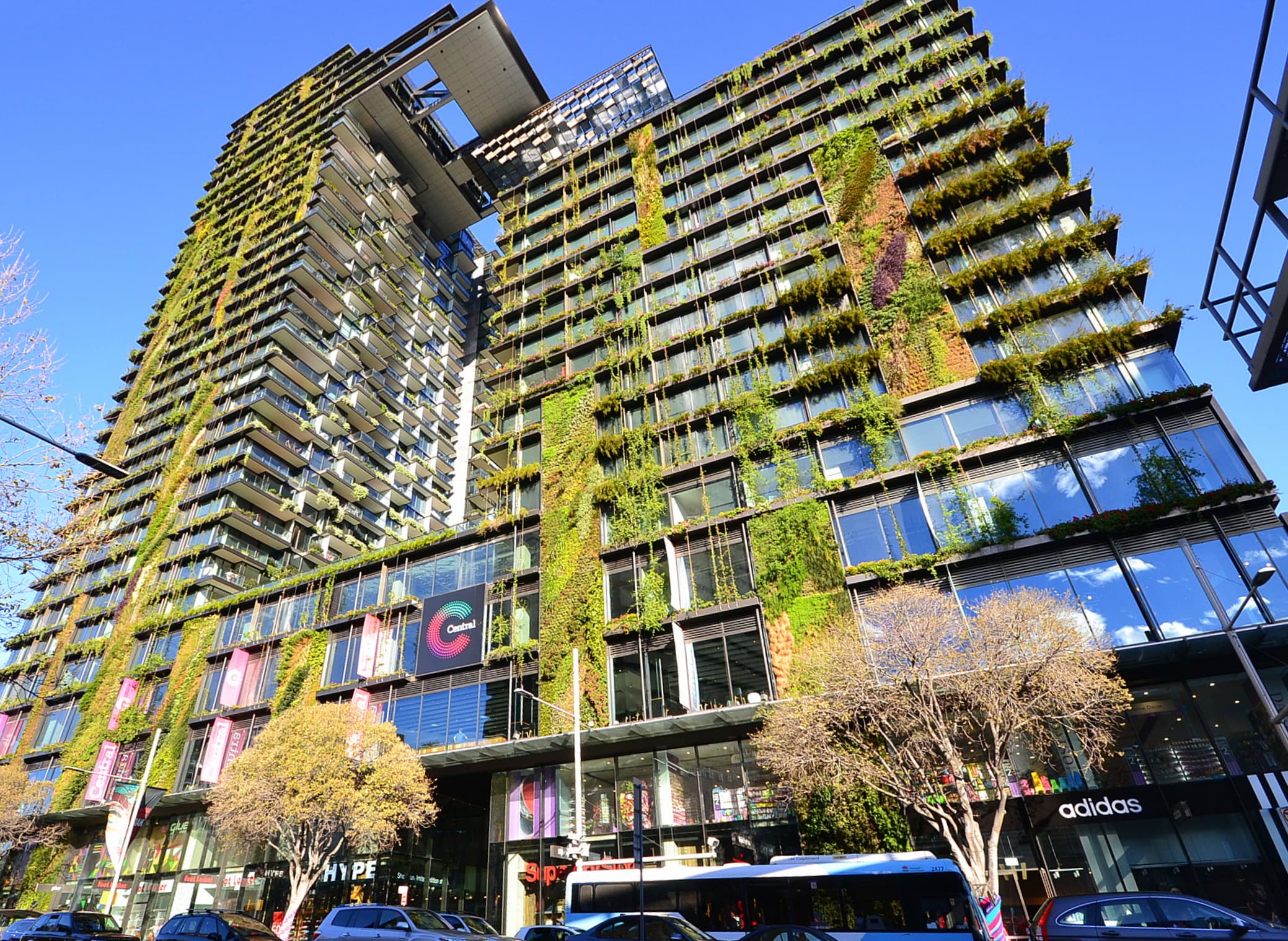 One Central Park towers on Broadway, Chippendale, showing the distinctive vertical gardens and cantilevered planter boxes on the facade
