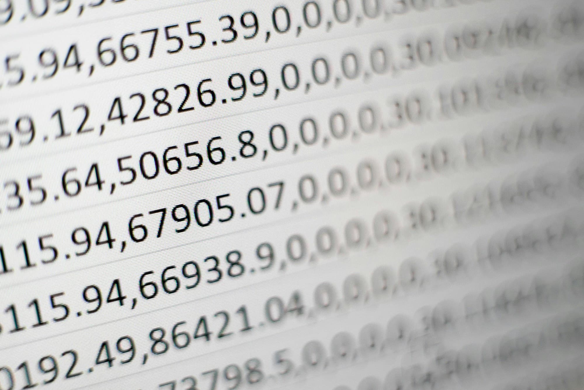 White printing paper with rows of numbers — representing data analysis